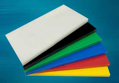 Close-up of white acetal plastic sheet used for precision machining applications
