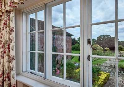 Clear acrylic sheet compared with traditional glass panel for strength and clarity