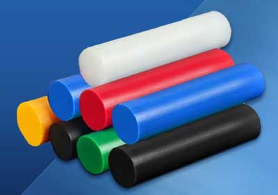 Close-up of different high-performance plastic rods used in engineering applications